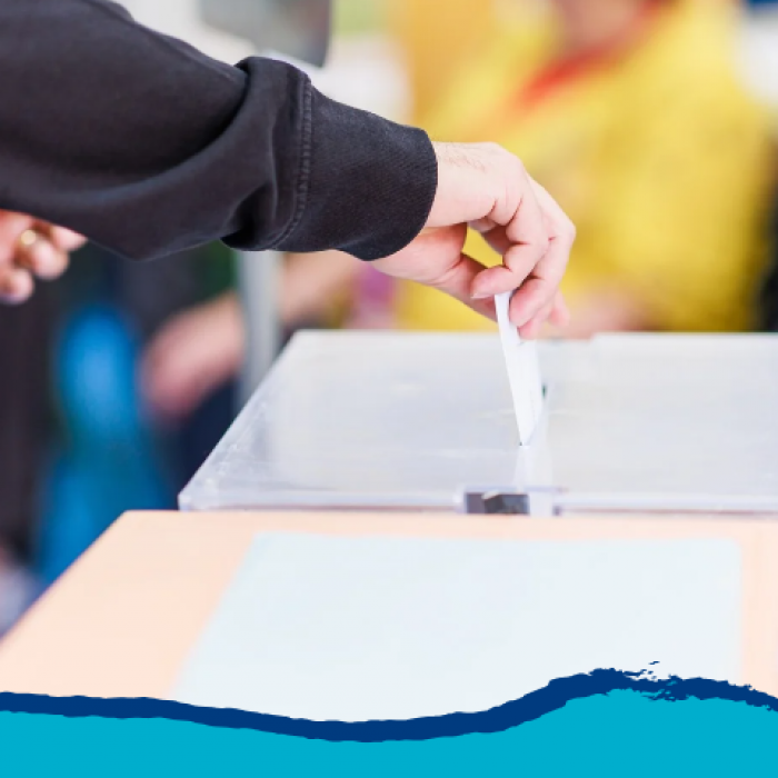 Data Drop graphic with image of man's hand casting a ballot into a box